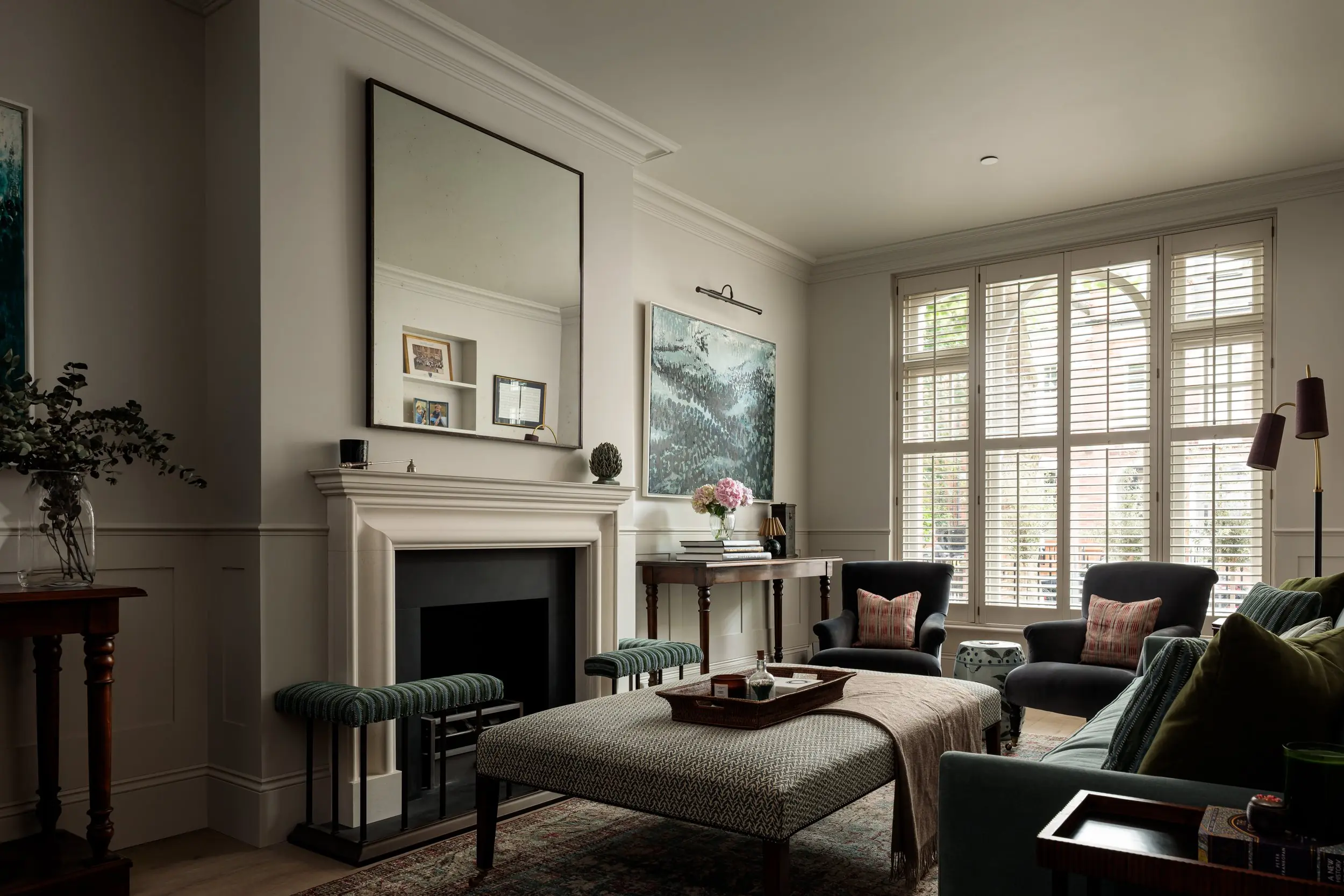 Front reception room with fireplace and shutters
