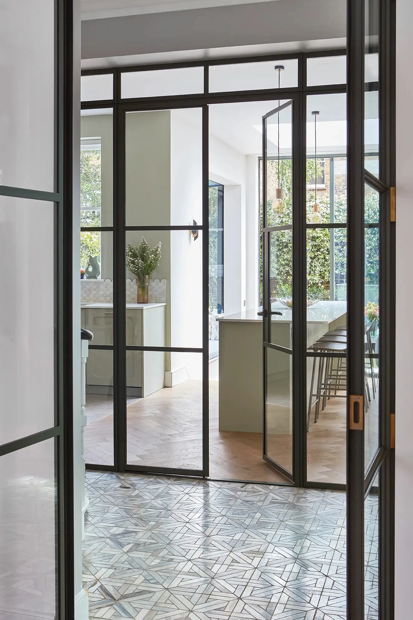Crittall doors between the hall and kitchen