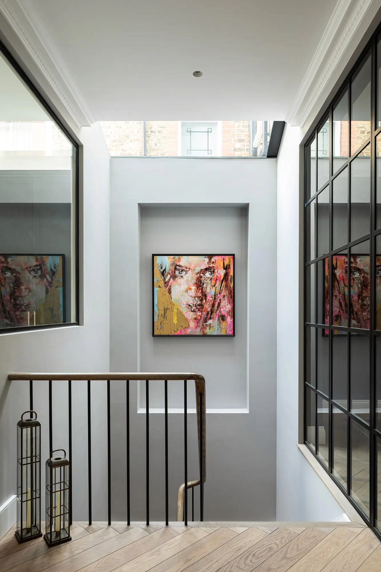 Timber handrail and artwork on the basement stair