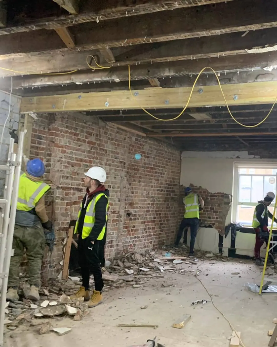 Stripped back to brick walls and timber joists.