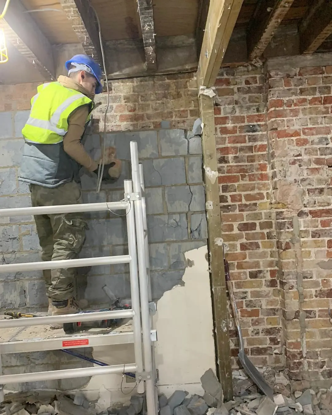 Old plaster off, brickwork exposed.