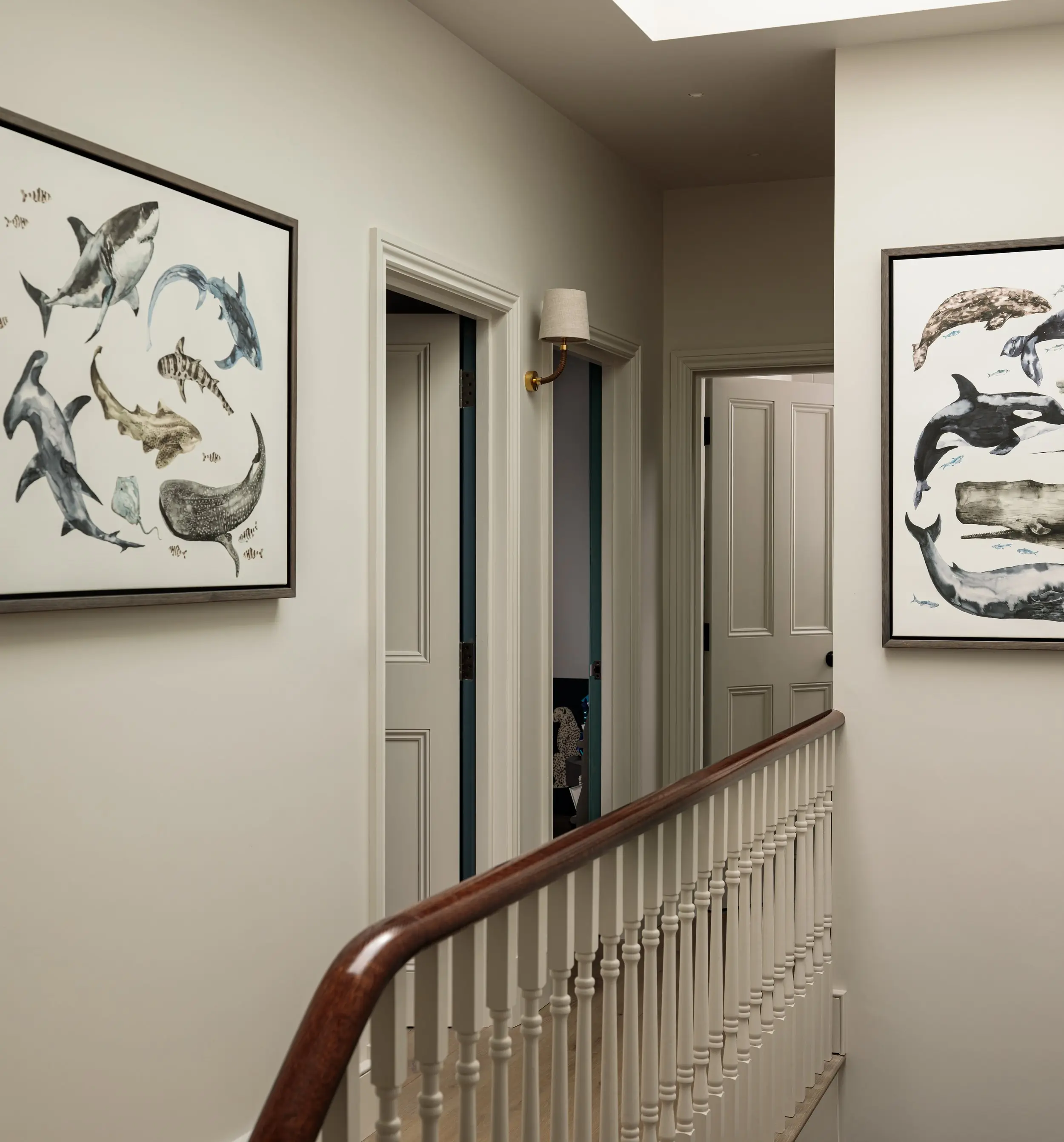 Landing prints above the original balustrade