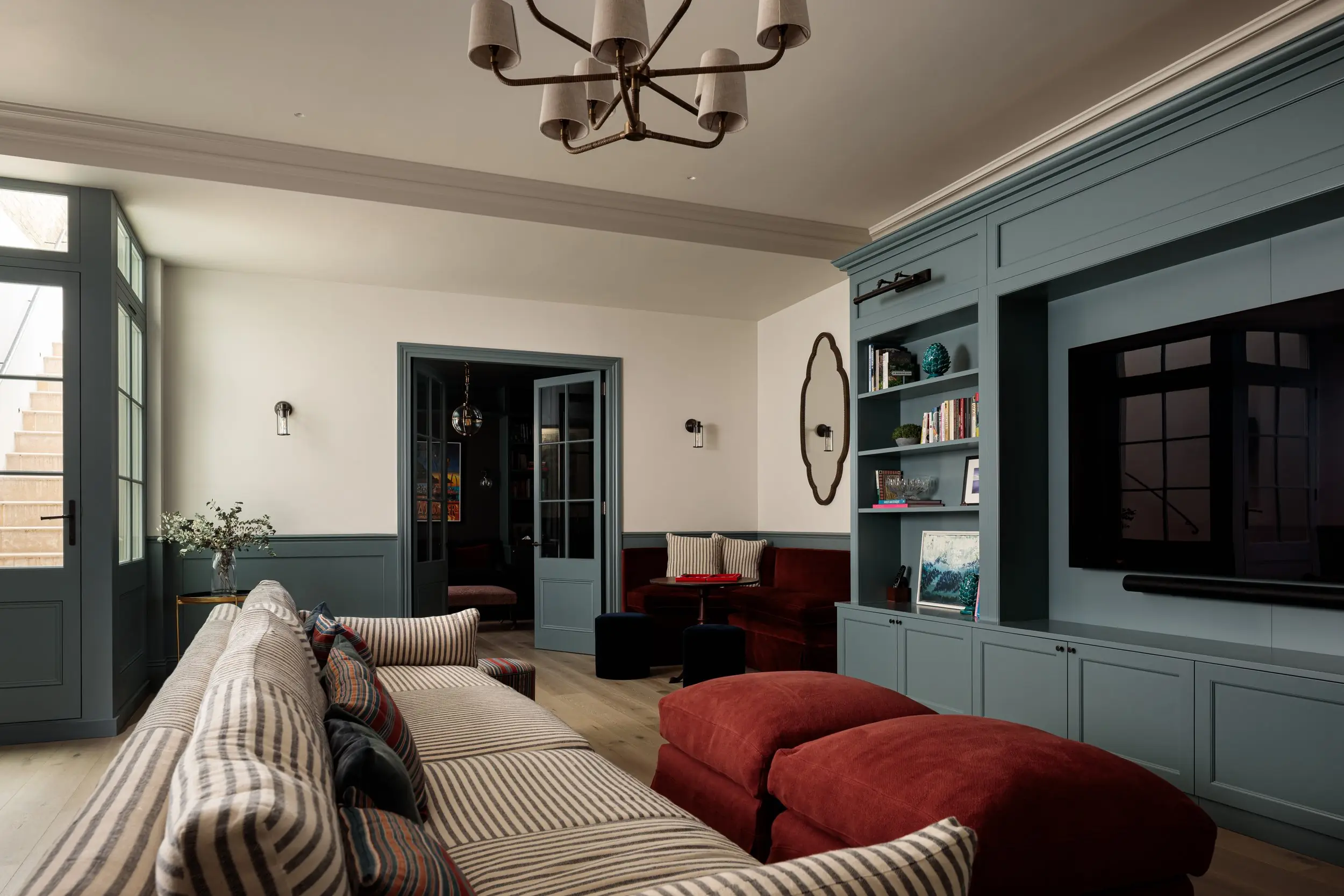 Chipstead — Basement family room with built-in blue joinery