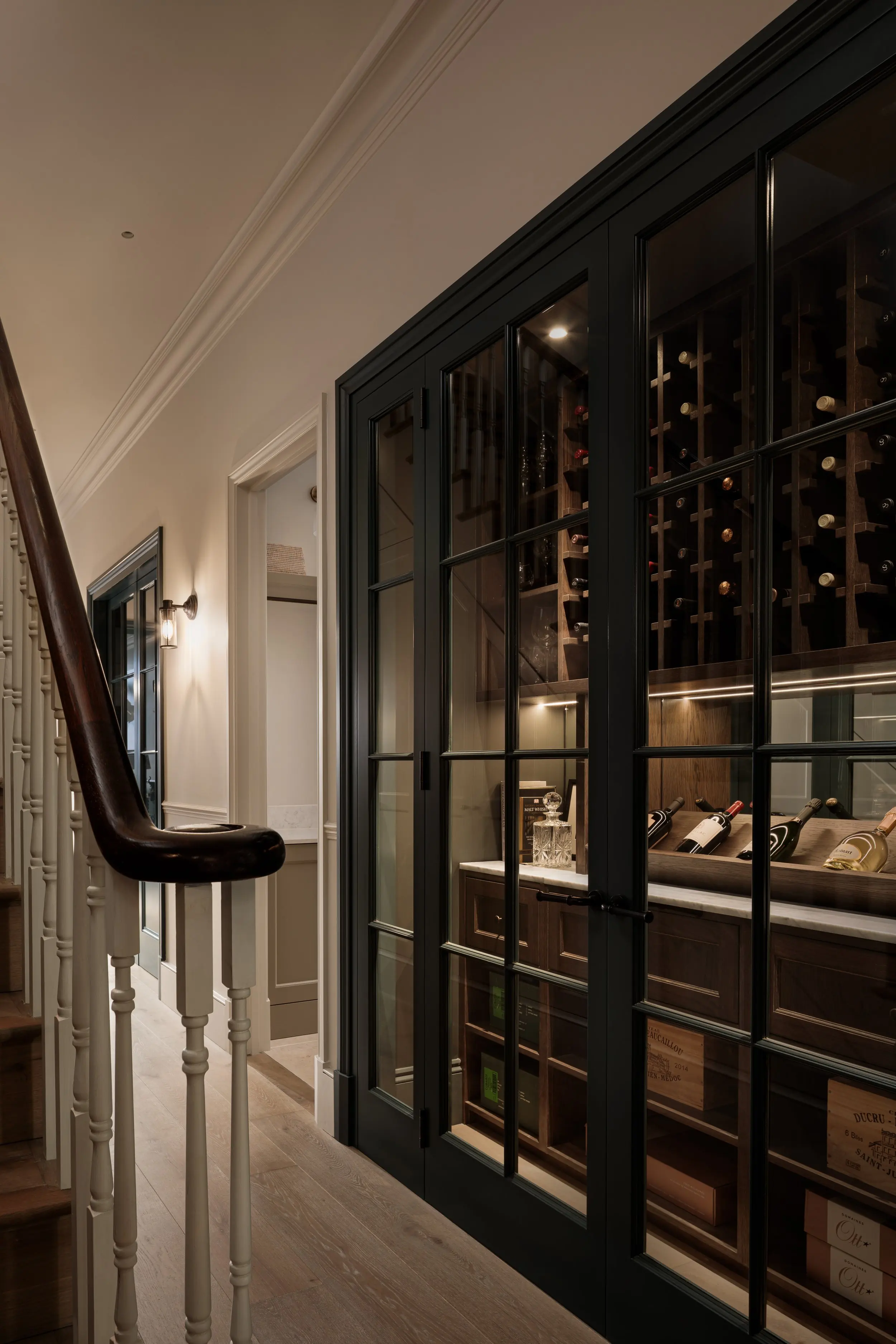 Glazed wine store beside the basement stair