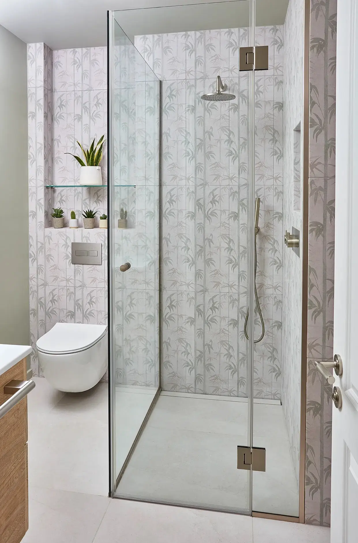Glazed shower against patterned wallpaper